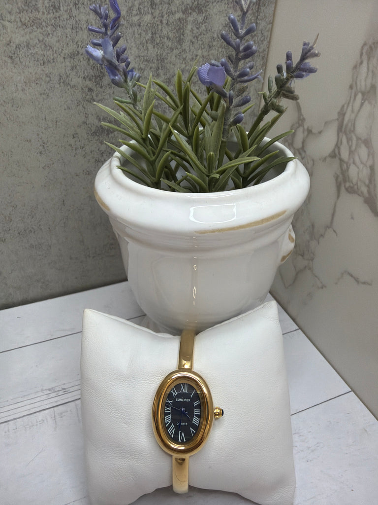 Black and Gold bangle watch