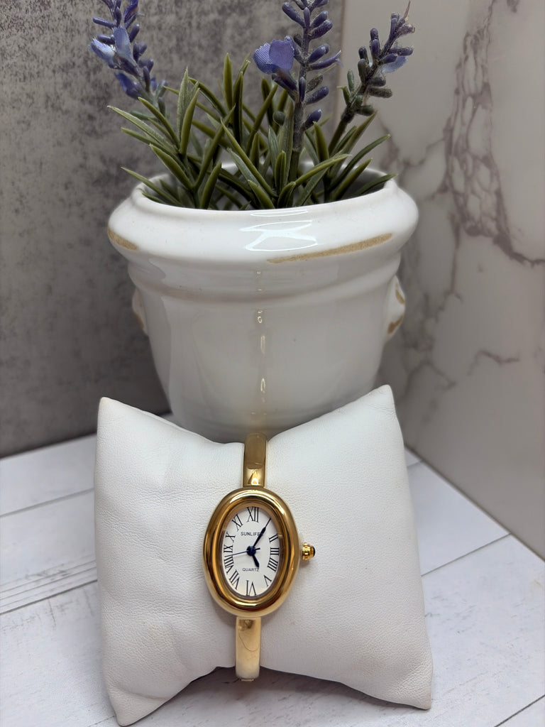 Gold and white bangle watch