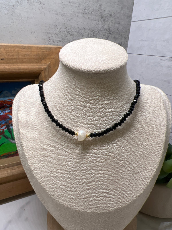Pearl in black neckless