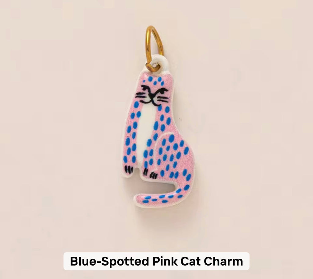 Blue spotted pink cat charm