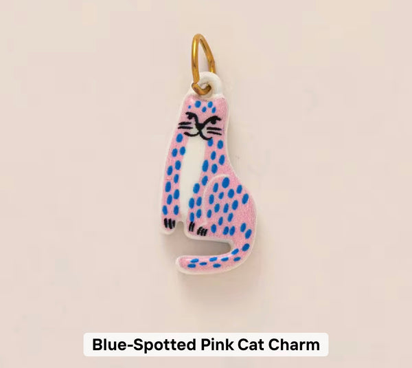 Blue spotted pink cat charm