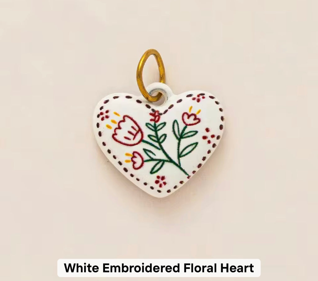 White embroidered floral heart
